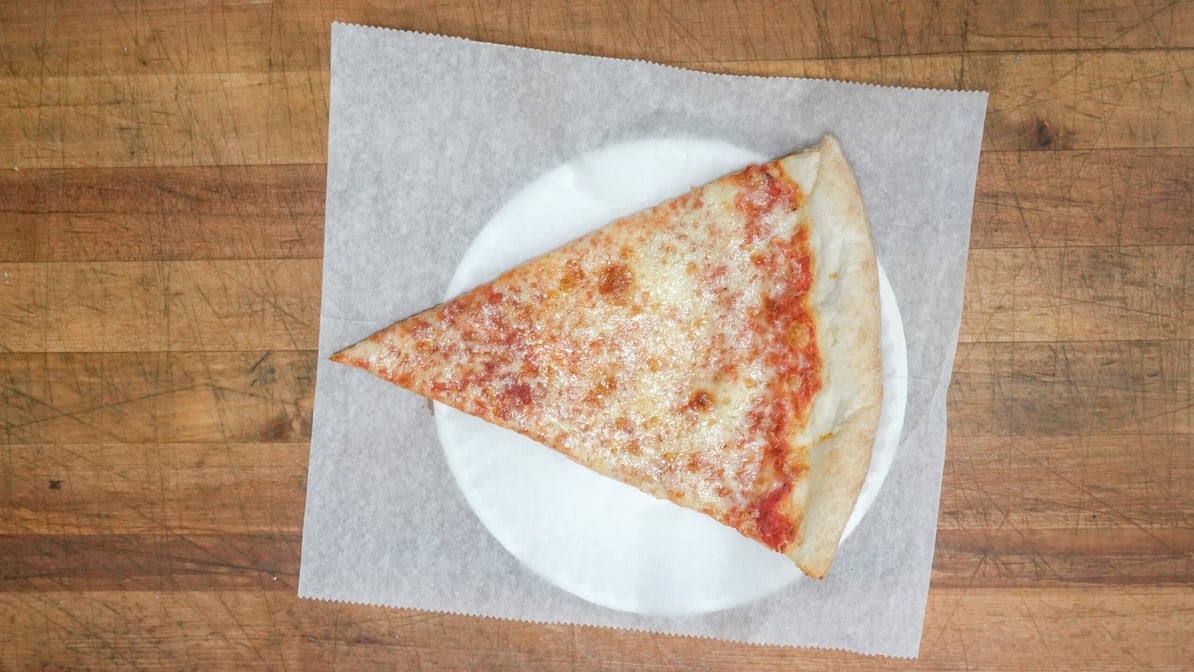 Cheese pizza slice on a plate
